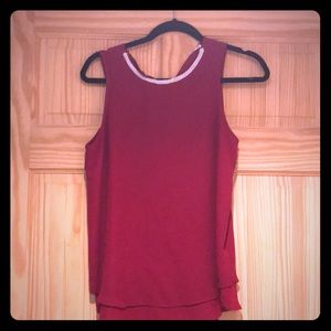 Flowy tank top with pearl detail around the neck.